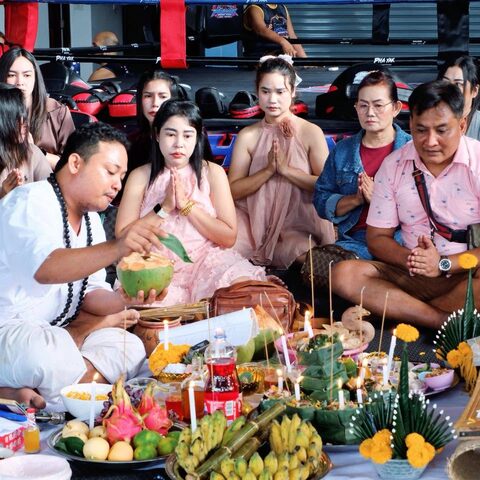 Guests seated around offerings during the opening blessing